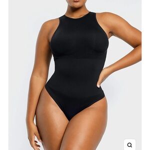 Xl body suit black does provide some support brand new